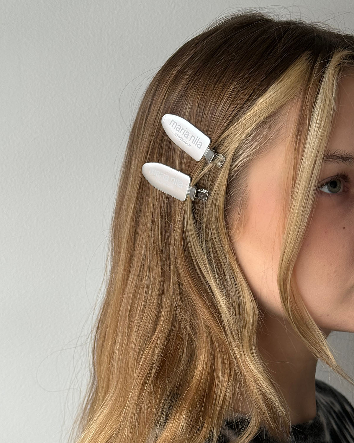 Silver hair clips in blonde hair