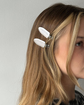 Silver hair clips in blonde hair