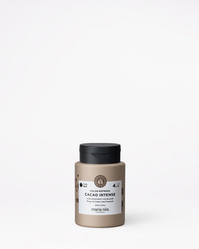 Hair color product jar labeled 'Cacao Intense' by Maria Nila on a white background