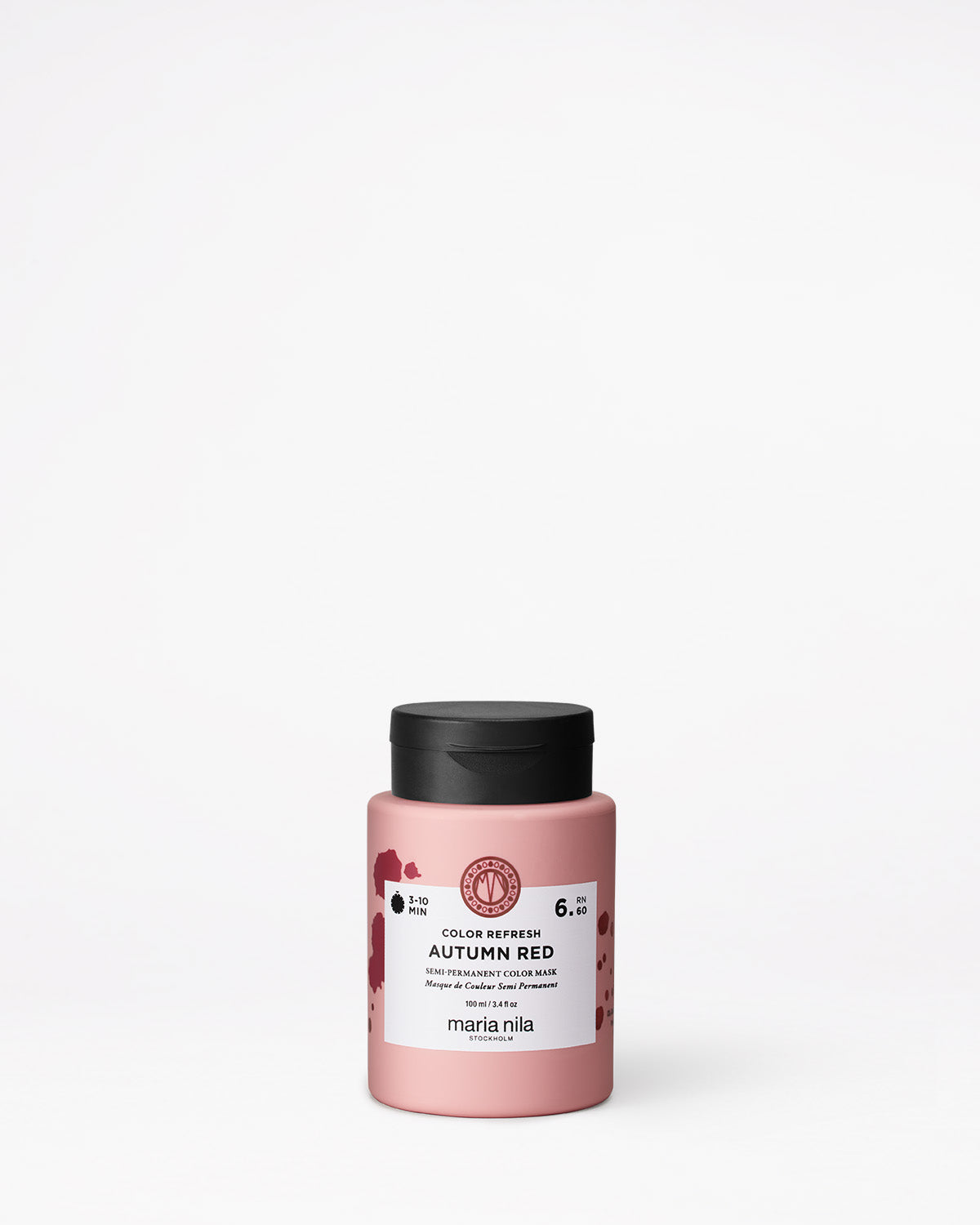 Pink hair color product with black lid on a white background