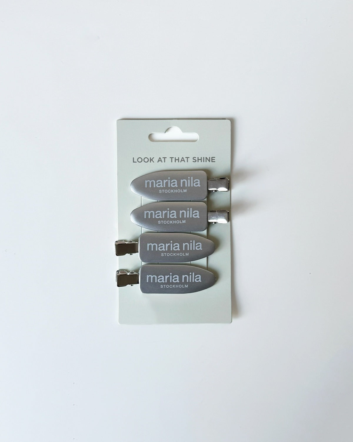 Set of four silver hair clips